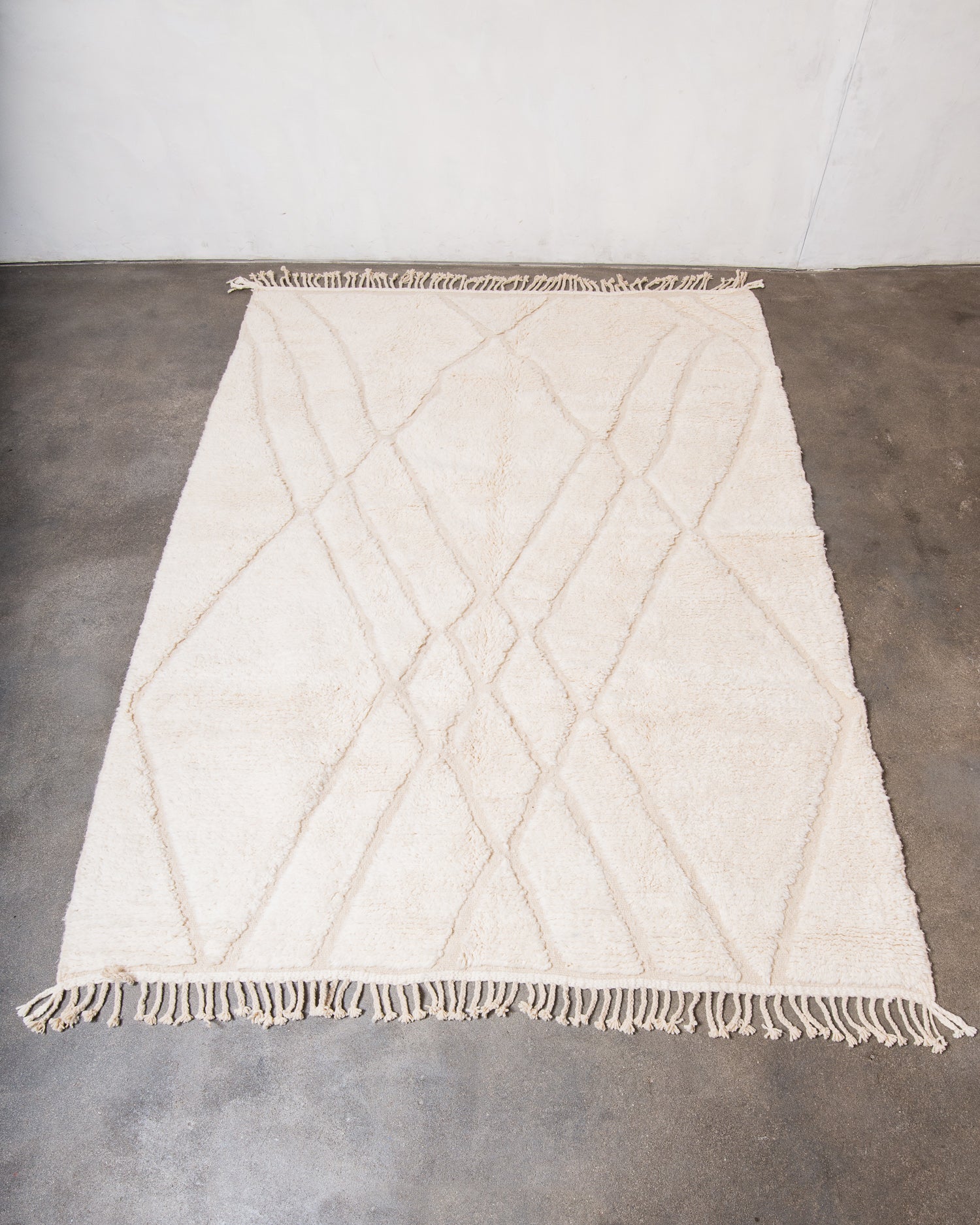 Modern, designer, handcrafted Berber rug from Morocco. Beniourain carpet with minimalist design, natural wool pile and a fluffy texture.